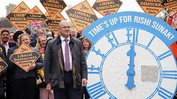 Ed Davey and supporters with gold diamonds celebrate